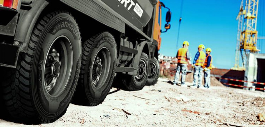tip truck and construction workers