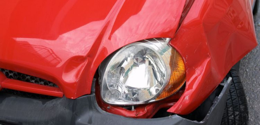 Crumpled wing of a small car after an accident