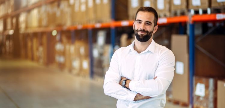 Logistics manager posing in warehouse