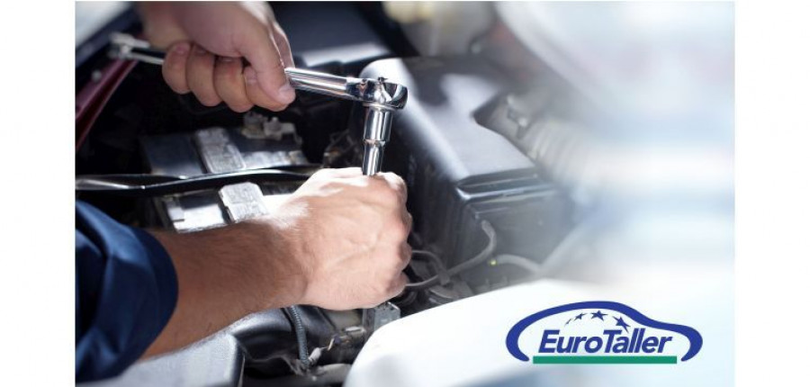 Hands of car mechanic in auto repair service.