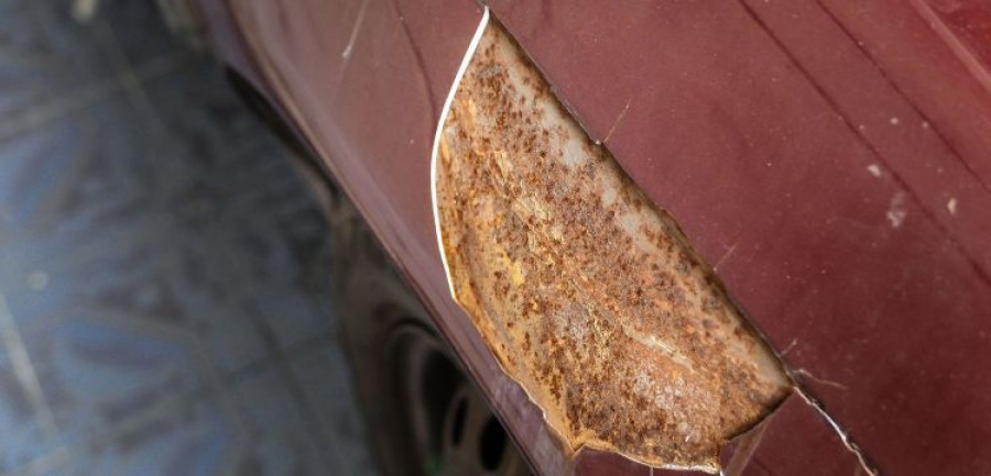 Rusty On Red Car. Crack Of Car Paint