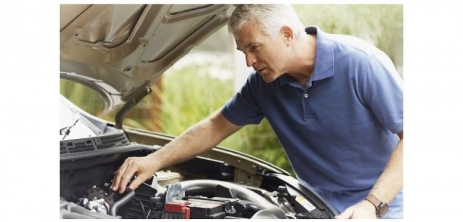 Man fixing his car engine